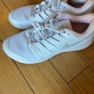 Nike tennis shoes, Women’s size 12.  White with pale pink detail. Court shoe.